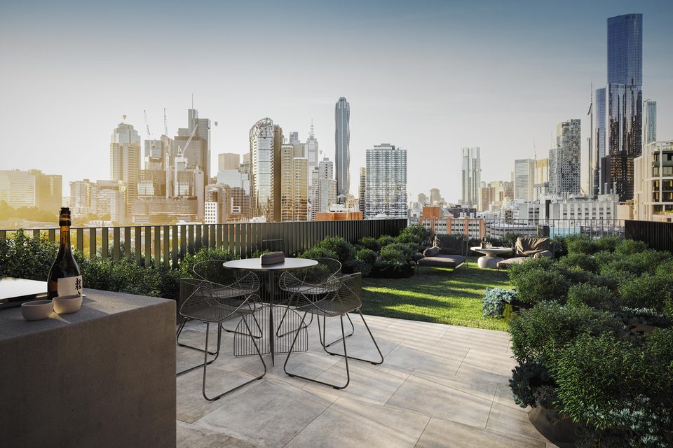 Concept render — rooftop garden terrace with a view across the Melbourne skyline at dusk