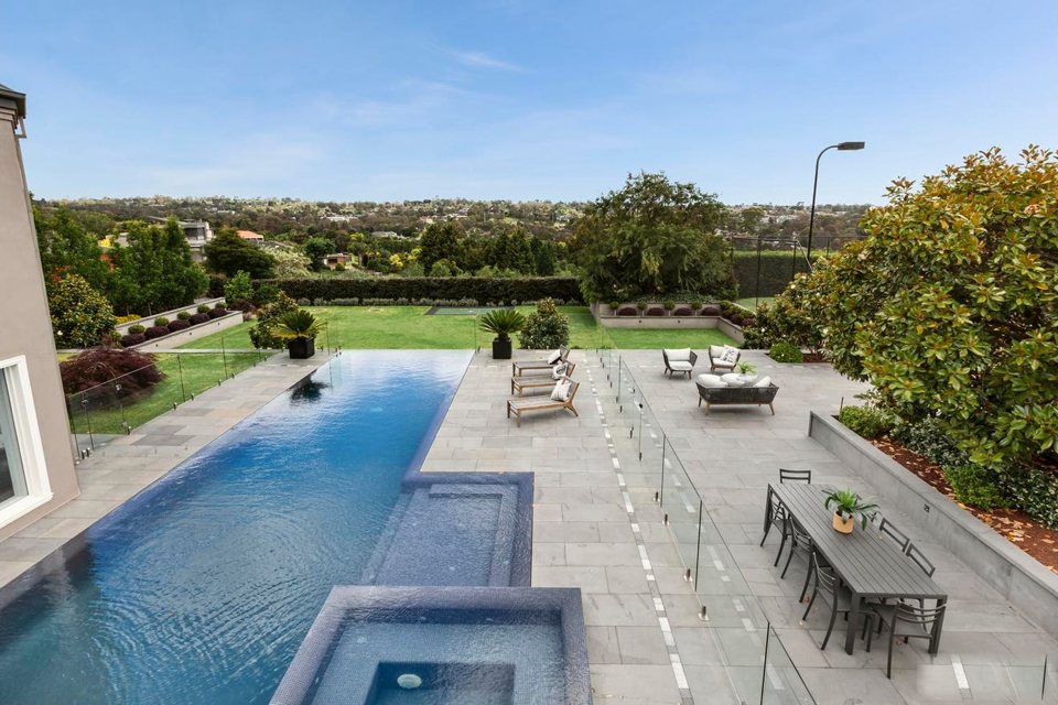 Elevated view of the pool terrace with outdoor dining